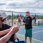 Photo by Emily Matthiessen/ On Saturday Pablo Granados, minor league pickleball NW director, explains the rules of the pickleball tournament at Carrie Blake park in Sequim held by the Sequim Picklers on Friday through Sunday, called both the Sequim Fling and the Sequim Lavender Cup Series and Scramble Events. This is the first time the club, which has close to 500 members, has held a minor league tournament. Granados said that he loves the fact that I can bring it out here. Saturdays opening ceremony included the Grand Olympics Chorus singing the national anthem and a tribute to Marty Hoffman.