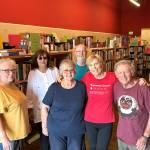 Sequim Gazette photo by Matthew Nash
Some of the approximate 20 volunteers with the Friends of Sequim Library gather for a photo while they sort materials for the July 12 book sale in Rock Plaza.