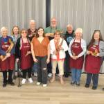 Sequim Gazette photo by Matthew Nash
Some of the Olympic Driftwood Sculptors club members presented Sequim High graduate Kaylie Steed with a $1,500 scholarship July 2 to help her pursuit of a career in art.