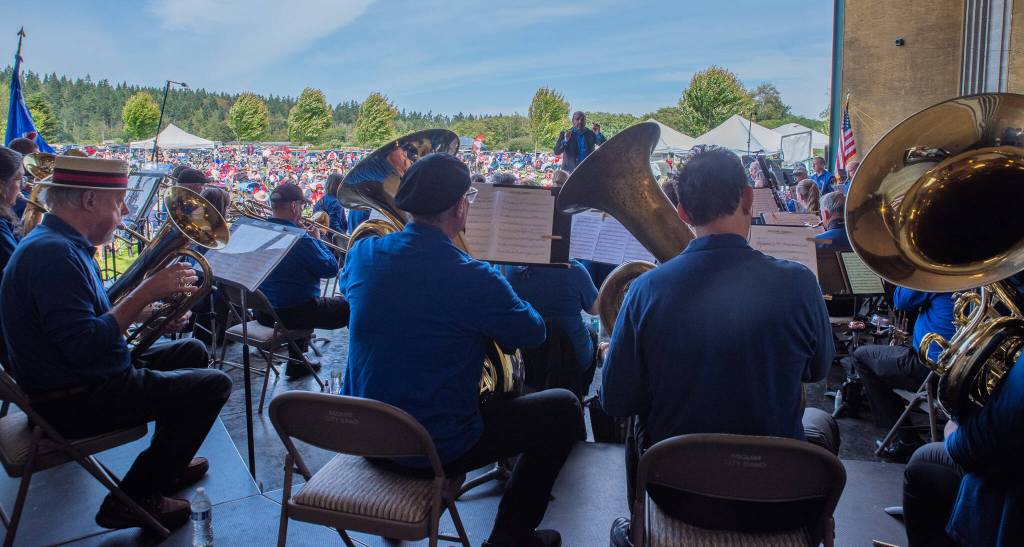 Sequim Gazette Photo by Emily Matthiessen/ Five bands played for those attending the Independence Day celebration at Carrie Blake Community Park in Sequim, beginning with the Sequim City Band directed by Tyler Benedict.