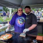 Sequim Gazette photo by Emily Matthiessen/ Angela and Jeffrey Anderson, mother and son duo of Shadowline, served up burgers until fireworks time at Carrie Blake Community Park during Sequims Independence Day celebration.