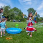 Sequim Gazette photo by Emily Matthiessen/ Laura Dyer and children Leon, 2, and Olivia, 4, and Madison Casteel, 7, play with bubbles supplied by the City of Sequim during Fridays Independence Day celebration at Carrie Blake Community Park.