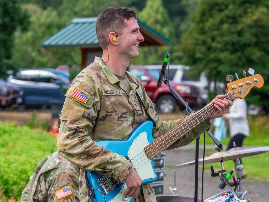 Sequim Gazette photo by Emily Matthiessen/ Joseph Ballestrasse on the base is announced as the youngest member of the 133d Washington Army National Guard Band at the City of Sequims Independence Day celebration in Carrie Blake Community Park.
