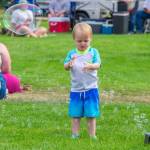 Sequim Gazette photo by Emily Matthiessen/ Maximilian McKnight, 3, of Port Angeles studies bubbles supplied by the City of Sequim at Fridays Independence Day celebration in Carrie Blake Community Park.