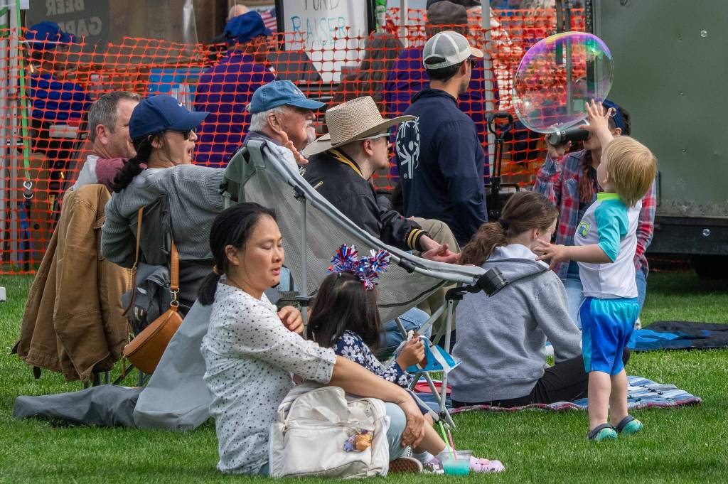 Sequim Gazette photo by Emily Matthiessen/ Maximilian McKnight, 3, of Port Angeles catches up with a bubble in Carrie Blake Community Park on Independence Day.