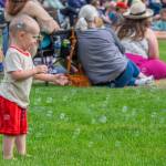 Sequim Gazette photo by Emily Matthiessen/ Milo, 2, of Parkland, was one of many children and adults who appreciated the bubbles supplied by the City of Sequim during Fridays Independence Day celebration at Carrie Blake Community Park.