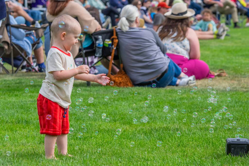 Sequim Gazette photo by Emily Matthiessen/ Milo, 2, of Parkland, was one of many children and adults who appreciated the bubbles supplied by the City of Sequim during Fridays Independence Day celebration at Carrie Blake Community Park.