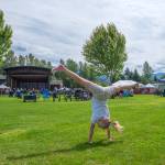 Sequim Gazette photo by Emily Matthiessen/ Maddie Parker, 10, turns cartwheels at Carrie Blake Community Park during the Independence Day celebration on Friday.