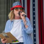 Sequim Gazette photo by Emily Matthiessen/ Brigitte Schlemmer announces during Sequim Citys Independence Day celebration at the James Center Bandshell in Carrie Blake Park Community Park on Friday.