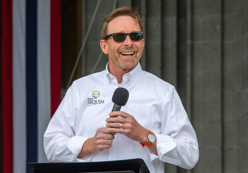 Sequim Gazette photo by Emily Matthiessen/ Sequim City Manager Matt Huish speaks during Sequim Citys Independence Day celebration at the James Center Bandshell in Carrie Blake Community Park on Friday.