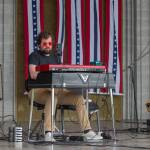 Sequim Gazette photo by Emily Matthiessen/ David Lux plays the keyboard for Casey Freedom at the James Center Bandshell during the Independence Day celebration.
