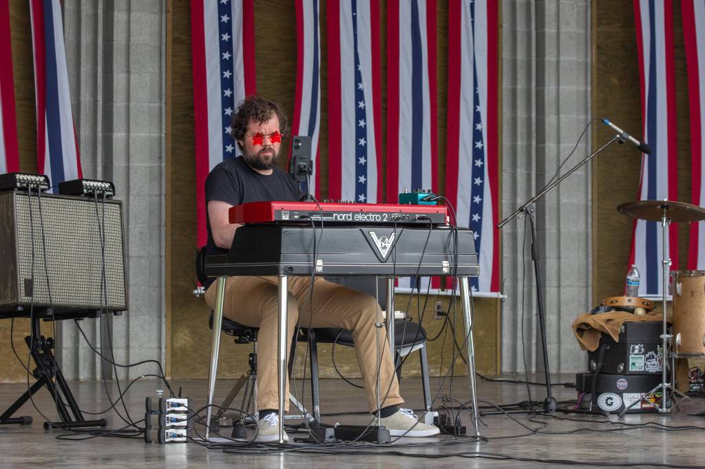 Sequim Gazette photo by Emily Matthiessen/ David Lux plays the keyboard for Casey Freedom at the James Center Bandshell during the Independence Day celebration.