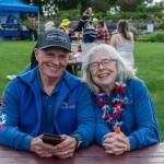 Sequim Gazette photo by Emily Matthiessen/ David and Janet Proebstel share a laugh during Sequims Independence Day celebration at Carrie Blake Park on Friday. The Proebstels are the only remaining charter members of the Sequim City Band, which began in 1992, they said.