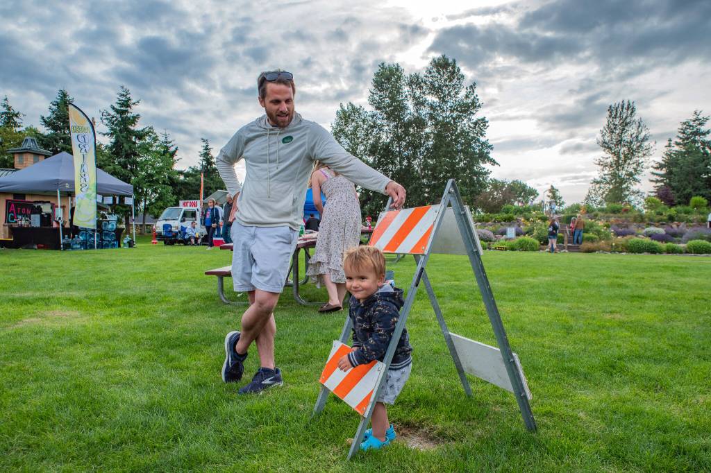 Sequim Gazette photo by Emily Matthiessen/ Watched by father Kelly, Sam Burger plays during Sequim Citys Independence Day celebration at Carrie Blake Community Park.