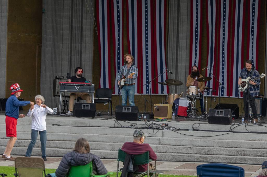 Sequim Gazette photo by Emily Matthiessen/ Mike VanWinkle and Nancy Koch dance to the tunes of Casey Freedom and band during Sequim Citys Independence Day celebration at the James Center Bandshell in Carrie Blake Park on Friday.