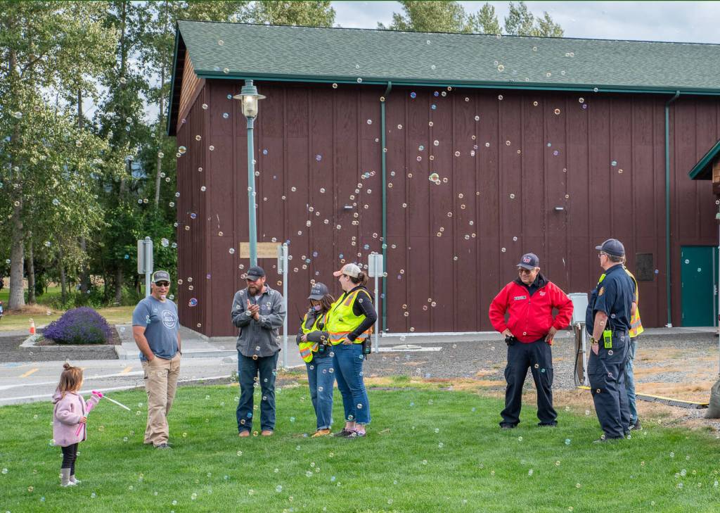 Sequim Gazette photo by Emily Matthiessen/ Sequim City employees provide the magic of bubbles to participants of the Independence Day celebration at Carrie Blake Community Park on Friday.
