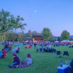 Sequim Gazette photo by Emily Matthiessen/ As Independence Day turns to night at Carrie Blake Community Park, people listen to the music of the band Great American Trainwreck.