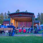 Sequim Gazette photo by Emily Matthiessen/ As Independence Day turns to night at Carrie Blake Community Park, people listen to the music of the band Great American Trainwreck.