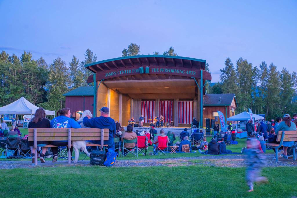 Sequim Gazette photo by Emily Matthiessen/ As Independence Day turns to night at Carrie Blake Community Park, people listen to the music of the band Great American Trainwreck.