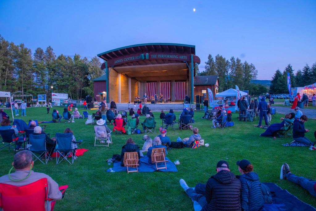 Sequim Gazette photo by Emily Matthiessen/ As Independence Day turns to night at Carrie Blake Community Park, people listen to the music of the band Great American Trainwreck.