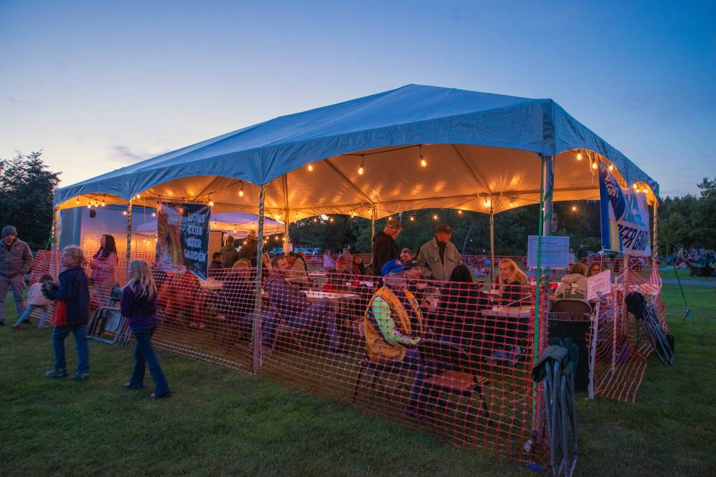 Sequim Gazette photo by Emily Matthiessen/ The Sequim Valley Lions Club raise money for their many community projects with a beer garden at the Independence Day celebration in Carrie Blake Community Park.