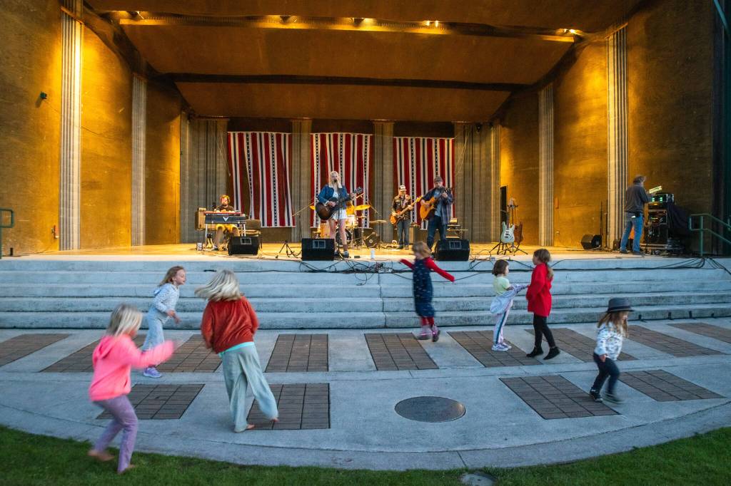 Sequim Gazette photo by Emily Matthiessen/ As Independence Day turns to night at Carrie Blake Community Park, children danced to the music of Great American Trainwreck.
