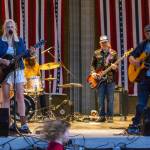 Sequim Gazette photo by Emily Matthiessen/ Great American Trainwrecks Stephanie Ward, Nick Nordahl, Dave Bush and Joe Cable (and David Lux, not seen) entertain the crowd at Carrie Blakes James Center Bandshell during the Independence Day celebration.