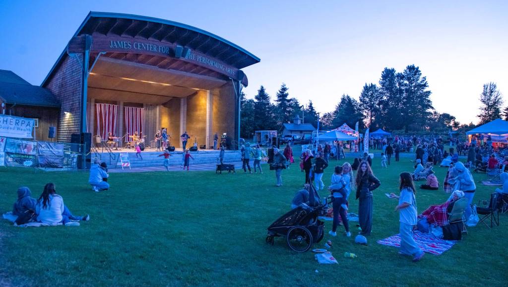 Sequim Gazette photo by Emily Matthiessen/ As Independence Day turns to night at Carrie Blake Community Park, children danced to the music of Great American Trainwreck.