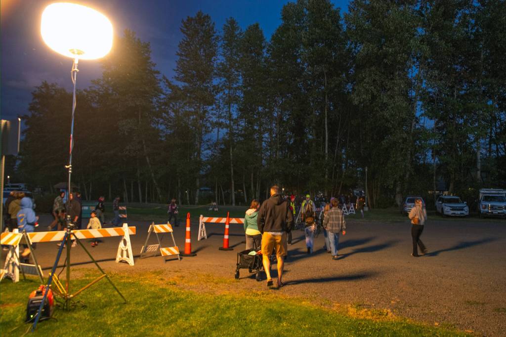 Sequim Gazette photo by Emily Matthiessen/ People head towards the prime viewing spot for fireworks during Sequim Citys Independence Day celebration on Friday.