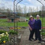 Photo courtesy of Sequim Botanical Garden Society/ Gail Ditmore, left, who designed the garden with Julie Malone, shares a light moment under one of the gardens arbors with Sequim Botanical Garden Society member and garden manager Mary Crook.