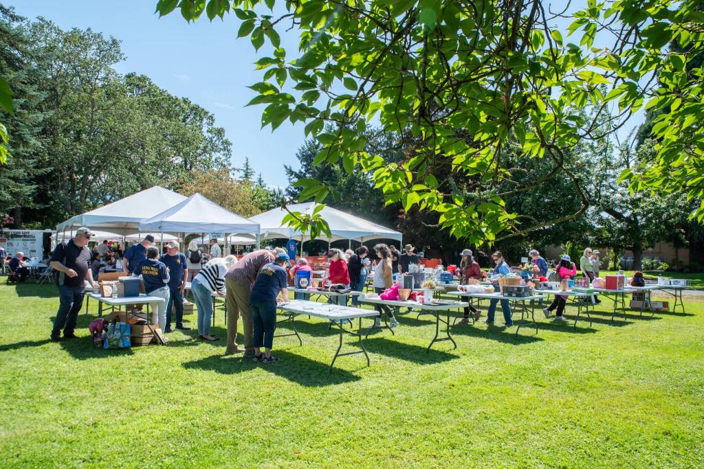 Sequim Gazette photo by Emily Matthiessen/ Silent auction tables at the Sequim Valley Lions Clubs 12th Annual Crab Feed offer up a range of items and experiences.