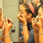 Sequim Gazette photo by Matthew Nash/ Actresses Cecelia Pereira (in pink band) and Gemma Himmelman ready their lioness makeup for a dress rehearsal for The Lion King Jr. at Sequim High School. Pereira plays Adult Nala while Himmelman Sarafina, her mother in the show. Find tickets for the show, which runs from July 18-27, at ghostlightwa.org.