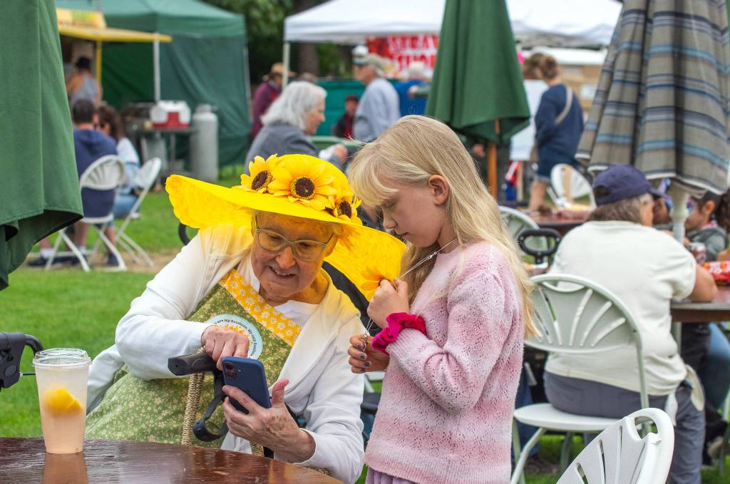 Sequim Gazette photo by Emily Matthiessen
Ruth Anne Hill of Edmonds shares with granddaughter Adelaide Hill-Grunau, 9, during the Lavender Festival at Carrie Blake Community Park.