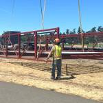 Sequim Gazette photos by Matthew Nash
City staff help navigate one of two new pedestrian bridges delivered to Carrie Blake Community Park.