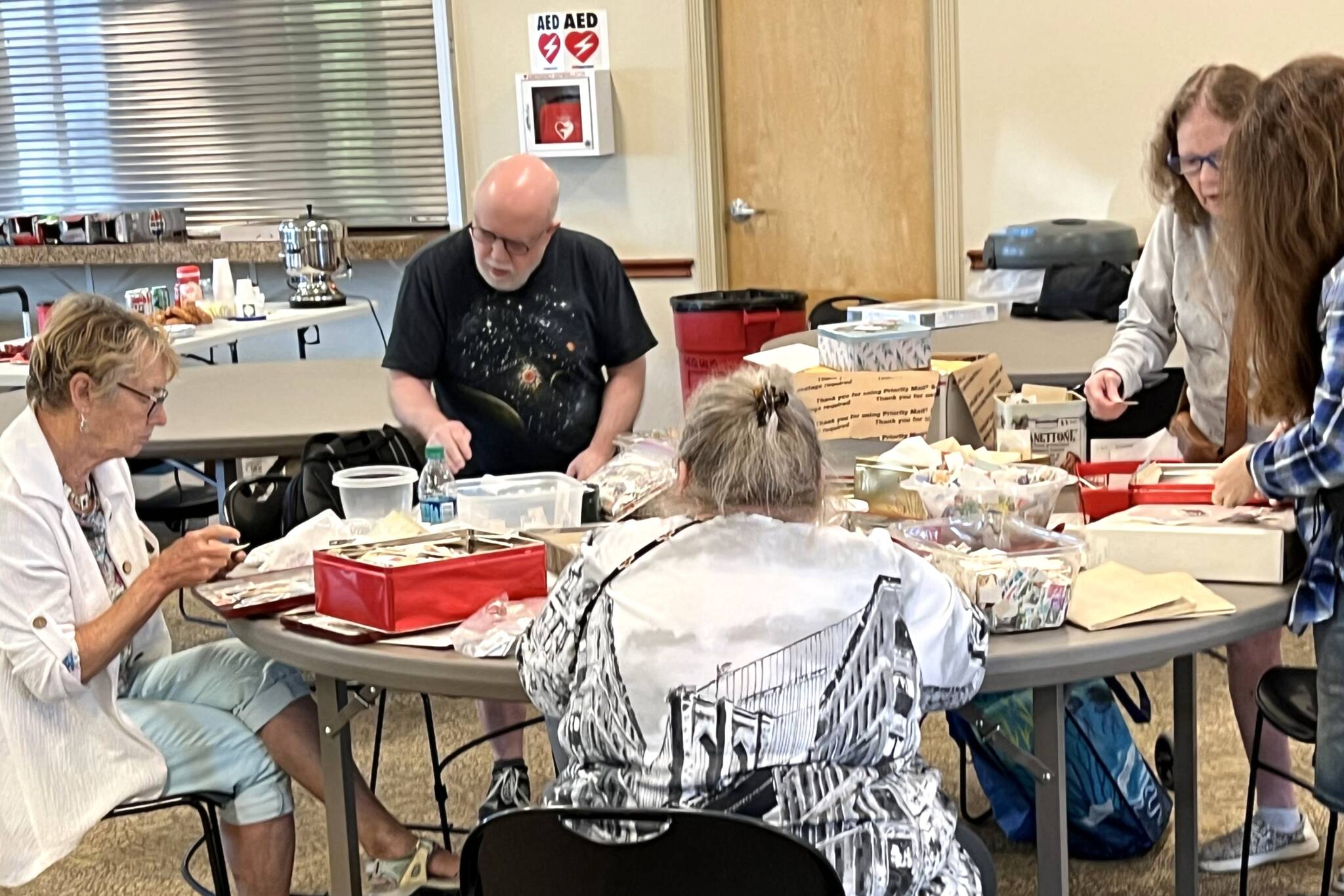 Photo by Judy Newblom
The penny table at the Strait Stamp Show in the Guy Cole Event Center remains a draw each year for children and the young at heart. The show is set for 9:30 a.m.-4:30 p.m. Aug. 9.