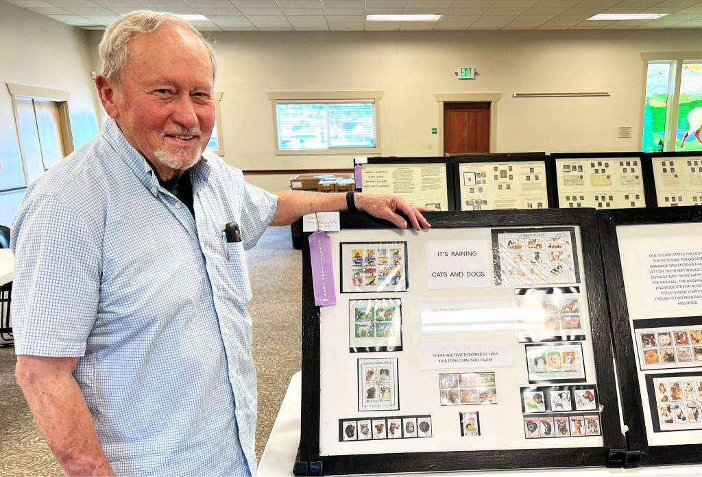 Photo by Judy Newblom/ Bruce Halstead stands with his 2024 exhibit Its Raining Cats And Dogs at the Strait Stamp Show. This year features several new and returning displays, collections, and vendors.