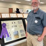 Photo by Judy Newblom/ Dave Fuller stands with his exhibit at the 2024 Strait Stamp Show. This years show on Aug. 9 features several new and returning displays, collections, and vendors.