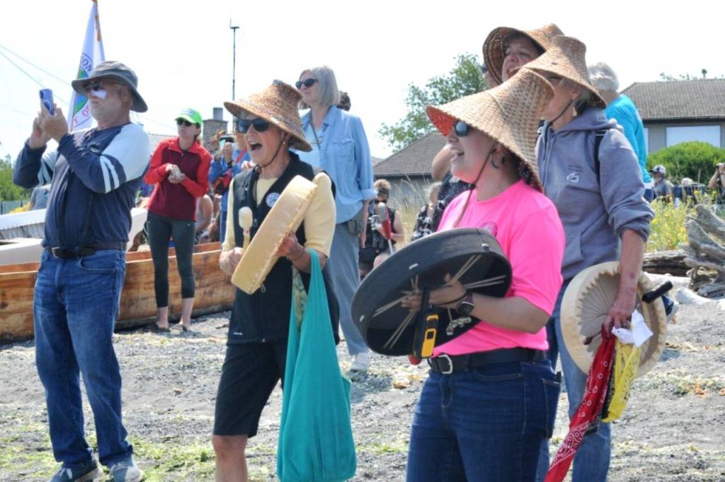 Sequim Gazette photo by Jacques Star/ Jamestown SKlallam Tribal elder Candace Burkhardt and tribal council member Loni Grinnell-Greninger sing to welcome the weary travelers after a long journey.