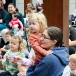Jessica Bond and her daughter Cora were a rapt audience for Jennifer LuBecke of NOLS as she led an outdoor program for little ones.