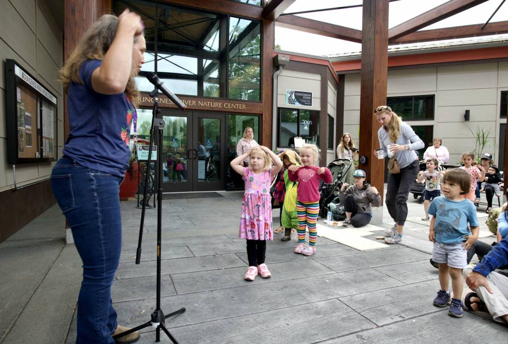 Jennifer LuBecke with North Olympic Library System (NOLS) leads Nature Storytime outdoors at the Dungeness River Nature Center in Sequim on Tuesday, Aug. 5. The program entertained tykes with nature-related stories, songs and rhymes.