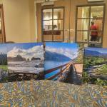 Photo courtesy John Gussman
Local photographs by John Gussman, pictured with Namaste Stayton, vice-president of hotel operations, are now on display throughout Holiday Inn Express Suites, including a 180-degree picture of the Olympic Mountains inside the elevators.