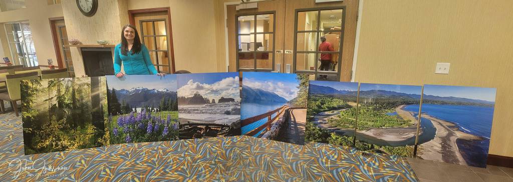 Photo courtesy John Gussman
Local photographs by John Gussman, pictured with Namaste Stayton, vice-president of hotel operations, are now on display throughout Holiday Inn Express Suites, including a 180-degree picture of the Olympic Mountains inside the elevators.