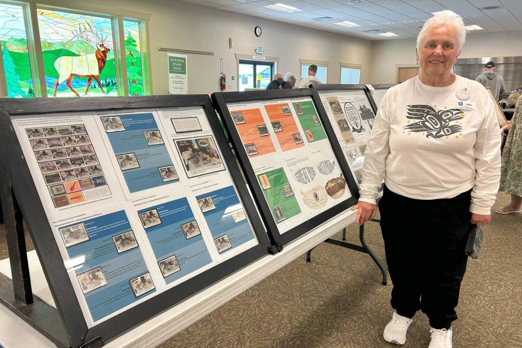 Sequim Gazette photo by Matthew Nash/ Vera Felts stands by her Northern Pacific Railway Poster Stamps exhibit on Aug. 9 at the Strait Stamp Show. She said the exhibit focuses on the complete collection of 26 stamps highlighting the railroads amenities, such as baked potatoes and a dining car in 1915. She believes its one of two known complete collections. Its fun to research and so fascinating, she said. Felts plans to give a presentation on the collection next spring in Moses Lake.