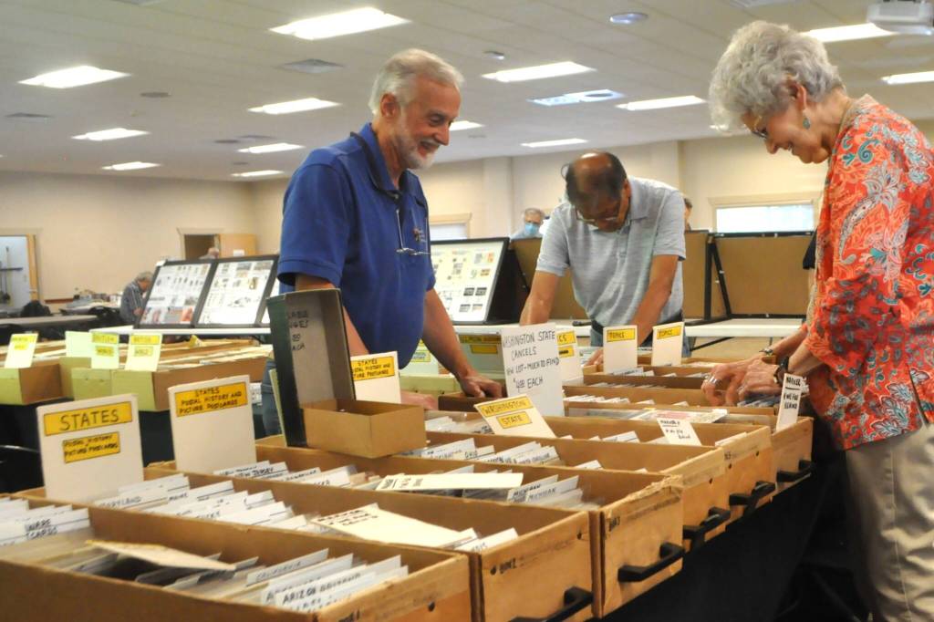 Sequim Gazette photo by Matthew Nash/ John Ullmann with Ullmann Collectibles of Edmonds exhibits for the seventh year at the Strait Stamp Show on Saturday. Ullmann said hes been in the stamp business for 55 years and finds the Strait Stamp Society in Sequim to be a great club with great people. He said he likes to visit the Sequim area early with his wife so they can take in the sights.