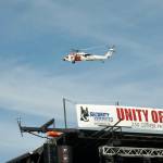 An MH-60T Jayhawk Coast Guard rescue helicopter arrives at the Unity of Effort community event.