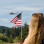 Sequim Gazette photos by Jacques Star 
Michelle Willis watches as a Coast Guard helicopter prepares to land at Saturdays Unity of Effort event in Sequiim.