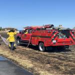 Photo courtesy Chris Turner, Clallam County Fire District 3/ Diamond Point Airports runway had two adjacent brush fires extinguished by Clallam County Fire District 3 firefighters on Aug. 11.
