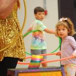 Sequim Gazette photo by Matthew Nash/ Vienna Beck of Port Angeles practices hula hooping with Hillia Hula at the North Olympic Library Systems Summer Reading Program.