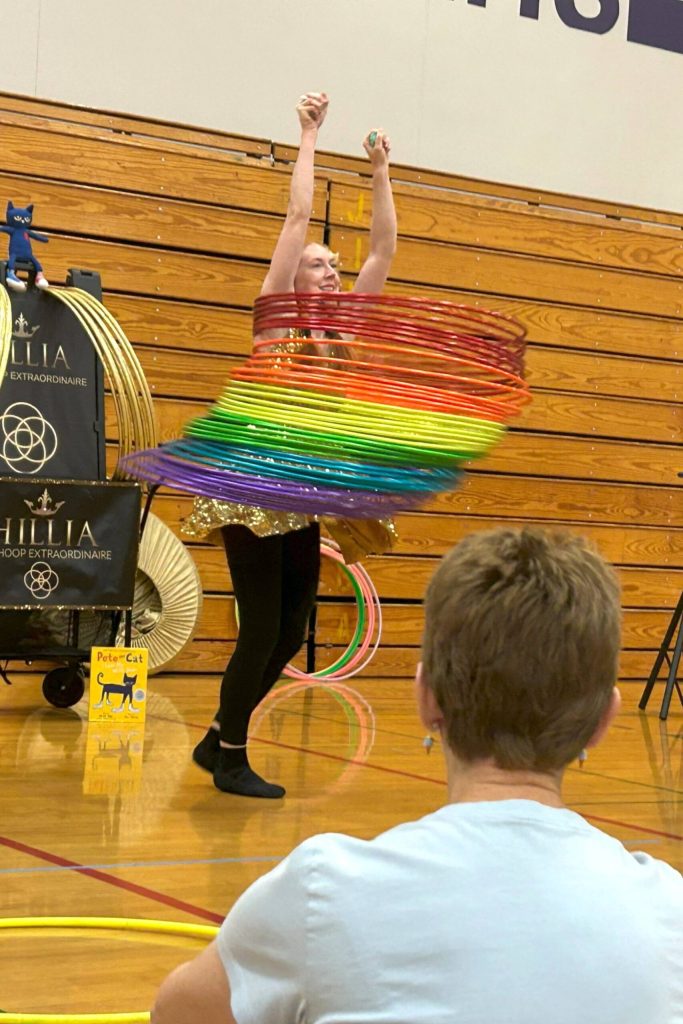 Hillia Hula encourages visitors of the Sequim Library Summer Reading Program by telling them that she learned to spin 40 hula hoops with just one to start.