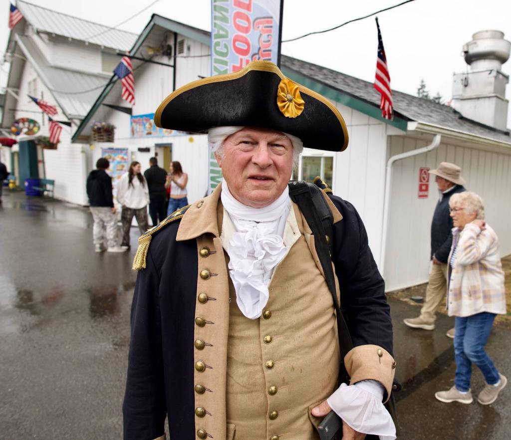 Vern Frykholm of Sequim, shown here at the Clallam County Fair, is among those participating in the North Olympic History Centers celebration of the upcoming 250th anniversary of the signing of the Declaration of Independence. His role includes speaking with attendees at events, having his photo taken, and assisting with the opening ceremonies of various events, such as rodeos and logging demonstrations.